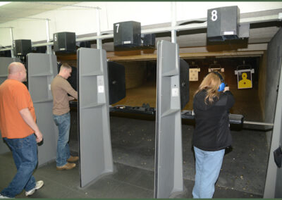 Indoor pistol range lanes in use