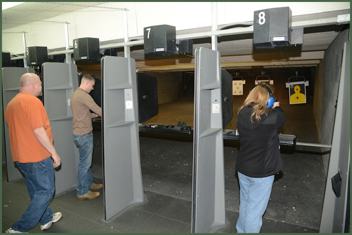 Indoor pistol range training session Indoor pistol range training session