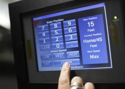 Touchscreen controls used to position an indoor range target.