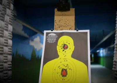 Paper target hanging in the blue mural indoor rifle range.